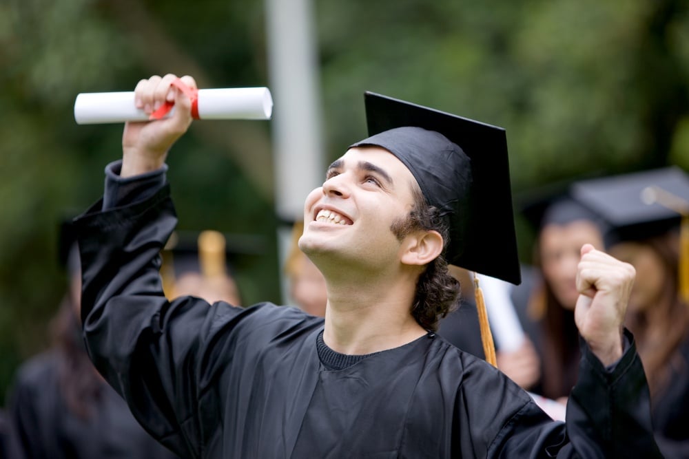 happy graduation student full of success outdoors